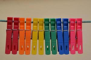 Rainbow colored clothespins on a line photo