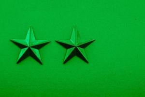 Two green stars on the green background photo