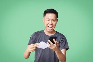 Happy man to win when he checks the documents photo