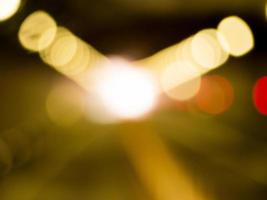 Blurred light gold bokeh abstract background photo