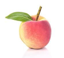 Fresh peach fruit on a white background photo