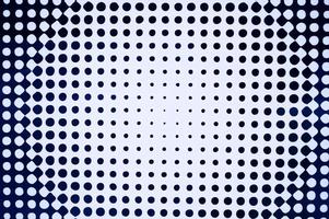 The texture of a white background with black circles of different sizes photo