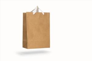Mockup of a recycled craft paper bag isolated on a white background photo