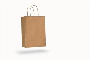 Mockup of a recycled craft paper bag isolated on a white background photo