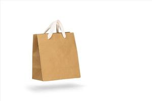 Mockup of a recycled craft paper bag isolated on a white background photo