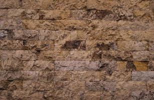 Old red brick pattern with cracks and scratches. Horizontal background of wide brick wall photo