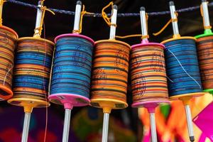 spools of hanging colorful thread photo