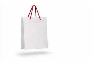 Mockup of a recycled craft paper bag isolated on a white background photo