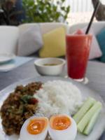 Thaifood basil chicken with boiled egg photo