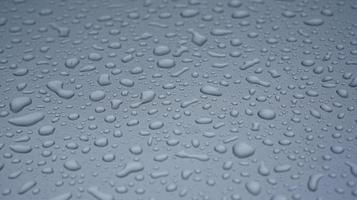 Waterdrop on a surface of a gray window isolated photo