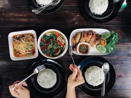 People eating Thai food photo