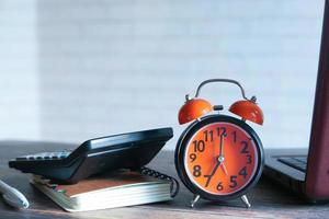 Alarm clock on a desk photo