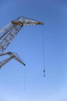 Crane against blue sky photo