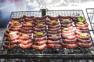 Roasted meat cooked on an outdoor grill photo