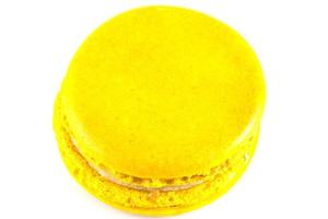 Yellow macaron isolated on white photo