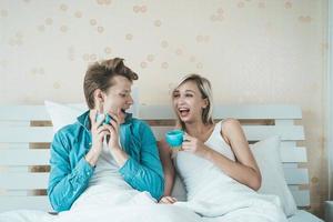 Happy couple drinking coffee in the morning photo