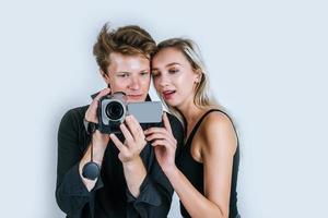 Happy portrait of couple holding microphones and singing photo