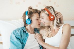 Happy couple listening to songs in the morning photo