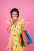 Fashionable woman with shopping bags and credit card photo