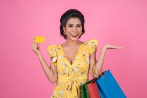 Fashionable woman with shopping bags and credit card photo