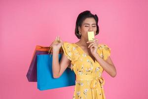 Fashionable woman with shoppings bag and credit card photo