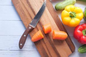 Fresh vegetables on chopping board photo