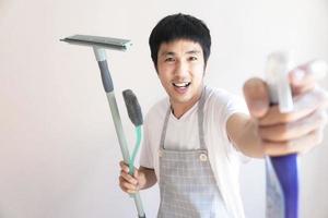 Asian man cleaning