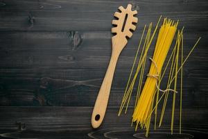 Spaghetti noodles and utensil photo