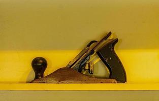 Woodworking planer on a yellow shelf photo