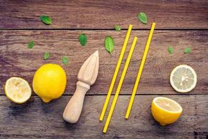 Fresh lemon and wooden juicer photo
