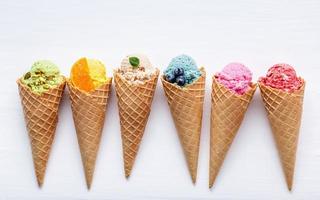 Colorful ice cream in cones isolated photo