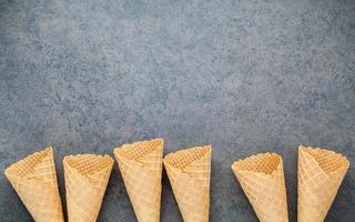 Waffle cones with copy space on a gray background photo