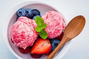 Raspberry ice cream with mixed berries photo