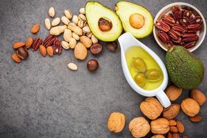 Top view of nuts and olive oil photo