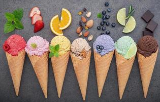 Ice cream in cones and fresh fruit photo