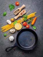 Spaghetti ingredients and a frying pan photo