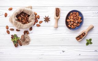 Cacao beans on shabby white wood photo