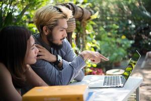 Education couple sitting at nature home garden reading for exam together photo