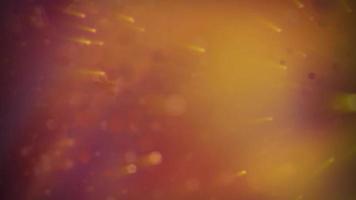 abstrakt suddig orange bakgrund med glödande partiklar video
