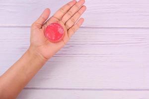 Pink petroleum jelly on table photo
