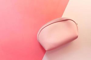 Women's purse or wallet on pink background photo