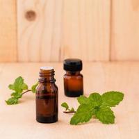 Bottles of mint essential oil photo
