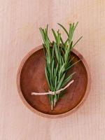 Fresh rosemary in a bowl photo