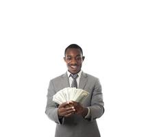 Young businessman holding money and showing to camera photo
