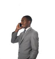 Young entrepreneur talking on cell phone isolated on white background