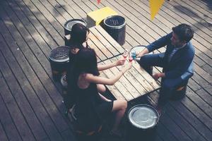 Portrait of happy young friends having fun and drinking together photo