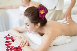 Young beautiful woman with healthy massage in a spa salon photo