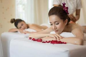 Young beautiful woman with healthy massage in a spa salon photo