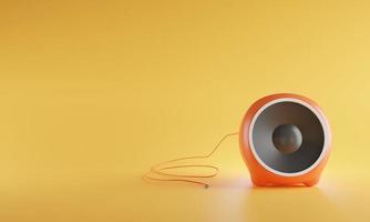 3D portable orange color sphere audio speaker isolated on yellow background photo