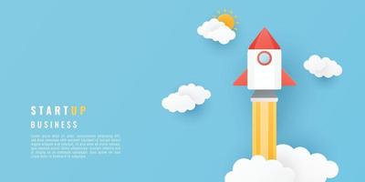 Start up business project concept. Paper cut style with space rocket, sun and clouds on blue background. Vector illustration.